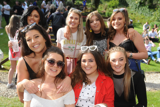 Some of the dance music fans enjoying the weather and music in the beer garden at Boozy Cow.