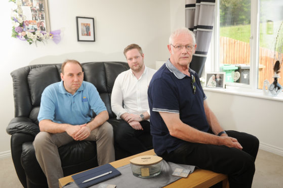 Ross Mackenzie and dad Graham with neighbour Thomas Docherty (left).