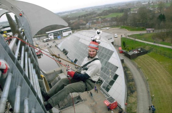 Kieran abseiled down the Falkirk Wheel to raise funds for his trip