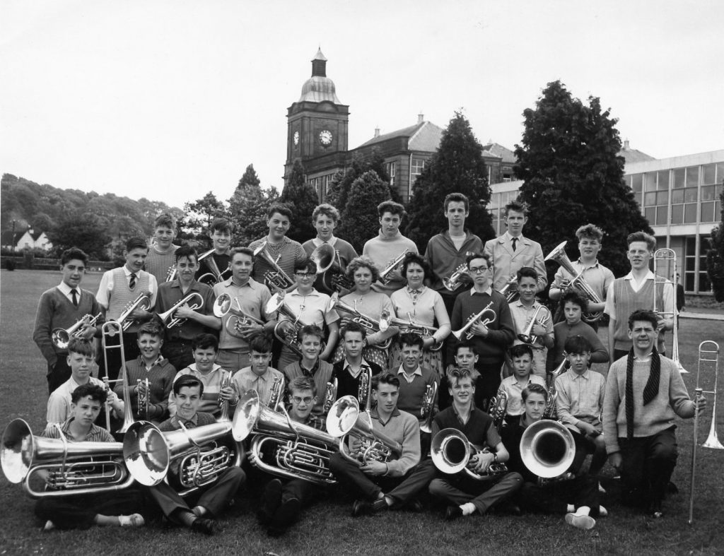 This is the National Youth Brass Band of Scotland in Kirkcudbright 1961 with John Wallace second row second from the left, John Miller third from left, Professor Sir David Wallace third row fourth from the left.