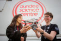 Science communicators Rachel Gillespie (left) and Emma Dixon with a Lego Mindstorm bot.