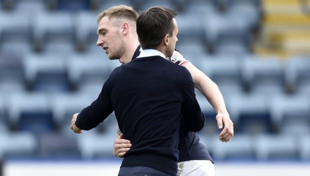 Kevin Holt with manager Neil McCann at full time.