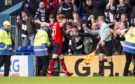 Simon Murray goes to celebrate his goal against Ross County with the travelling Dundee fans.