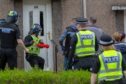 A drugs raid at a house in Cramond Gardens, Kirkcaldy.