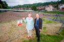 Campaigner Liz Barrett and Councillor Willie Wilson at the fenced-off park.
