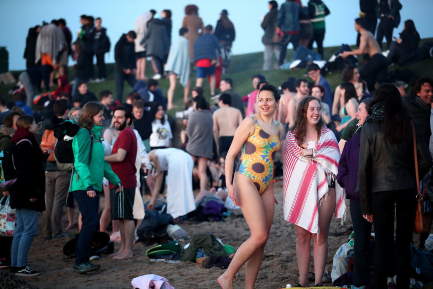 PICTURES St Andrews students strip off for traditional May Day dip