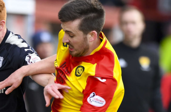 Callum Booth in action against Dundee.