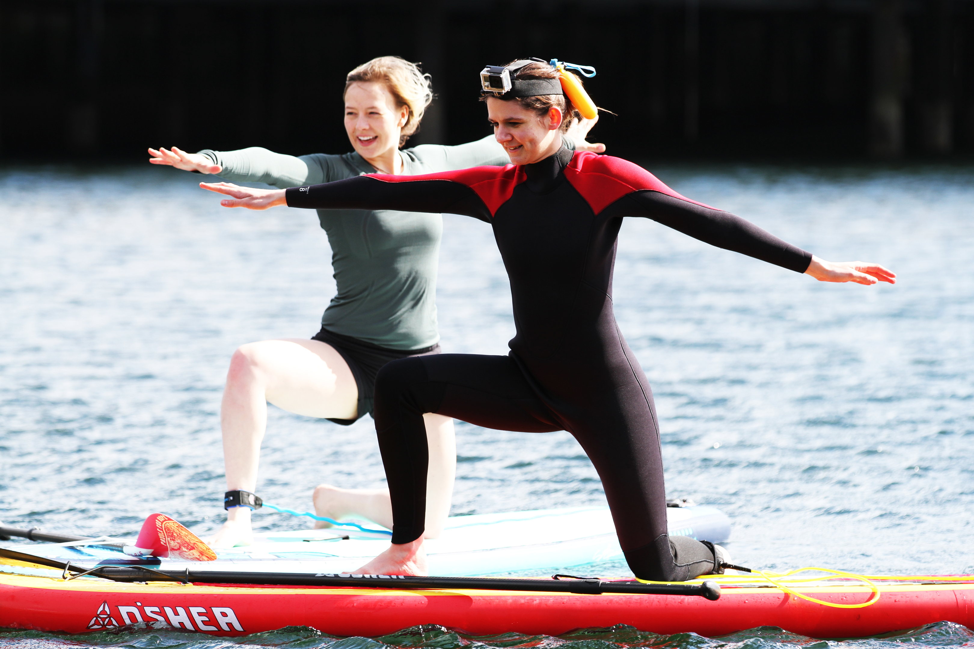 SUP yoga teacher Michaella Robb and Nadia on their paddleboards.