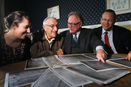 Stanley Barrie (second left) was handed documents showing his father on the crew list for a 1908 whaling expedition