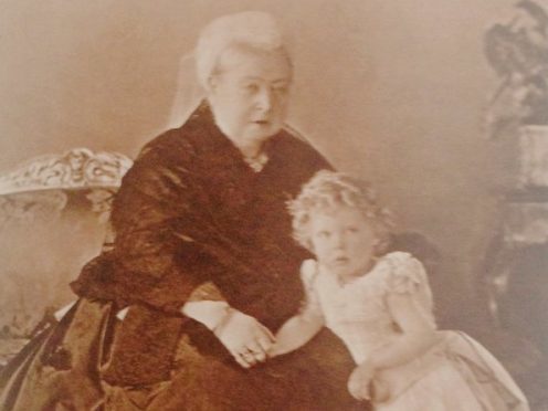 Queen Victoria wearing the dress (or similar) with her great grandson, Prince Edward, later King Edward VIII.