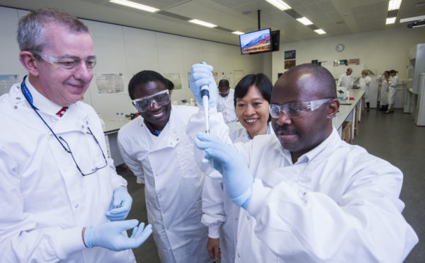 Dr Sabiiti, right, demonstrates the test to Frank Bonsu from Chana and Thuong Nguyen from Vietnam, while Professor Gillespie, left, looks on