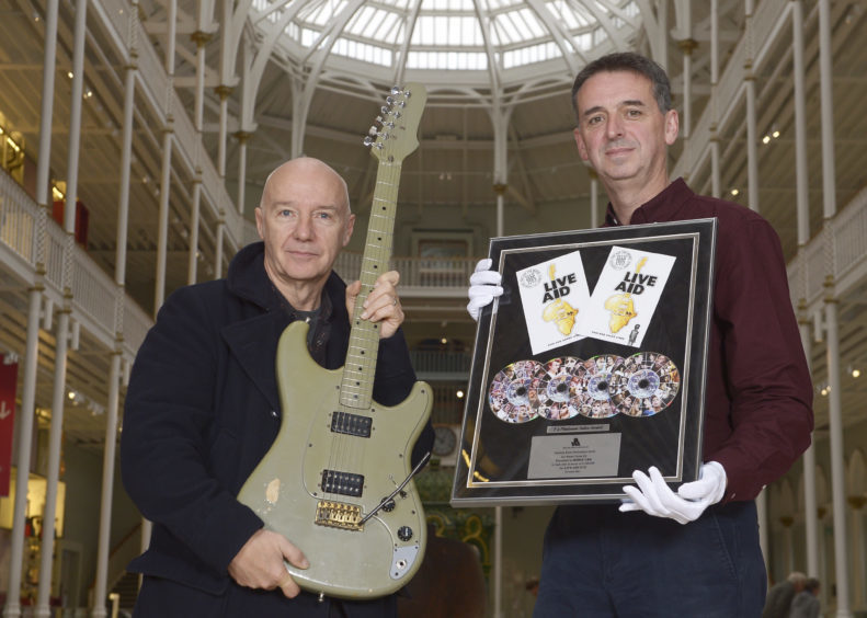 Midge Ure with Stephen Allen, curator at the National Museum of Scotland