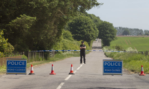 Police at the scene after body found Loch of Kinnordy Nature Reserve.