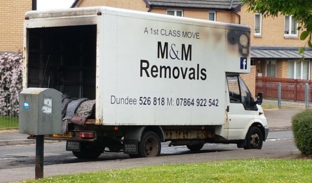 The fire damage to Mark's removal van.