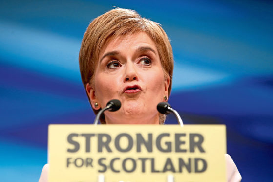 First Minister Nicola Sturgeon delivers her keynote speech to delegates at the Scottish National Party's spring conference at the Aberdeen Exhibition and Conference Centre (AECC), Aberdeen. PRESS ASSOCIATION Photo. Picture date: Saturday June 9, 2018. See PA story POLITICS SNP. Photo credit should read: Jane Barlow/PA Wire