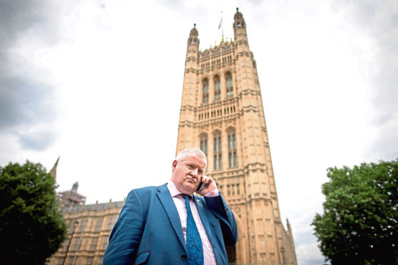 SNP Westminster leader Ian Blackford, on the phone, after he was kicked out of House of Commons sittings for the rest of the day after repeatedly challenging Speaker John Bercow. PRESS ASSOCIATION Photo. Picture date: Wednesday June 13, 2018. See PA story POLITICS Blackford. Photo credit should read: Stefan Rousseau/PA Wire