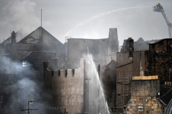 Fire fighters battle a blaze at the Glasgow School of Art for the second time in four years on June 16,