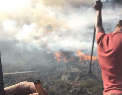Angus gamekeepers tackling the blaze on the Invermark Estate.