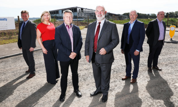 The official opening of the new link road to Bertha Park. 
Picture shows; Bertha Park Head Teacher Stuart Clyde, Victoria Bramini from Scape,  Councillor Angus Forbes, Council Leader Murray Lyle, Hector MacAulay and Graeme Dickie from Balfour Beatty on the new road link beside the new school.