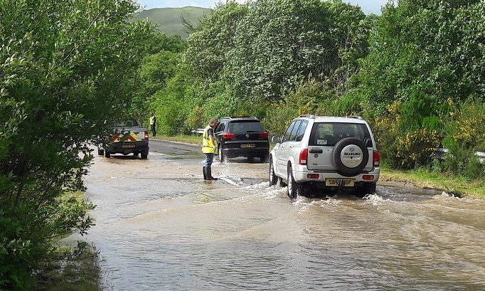 Motorists struggling on the flooded A823 on Monday evening.