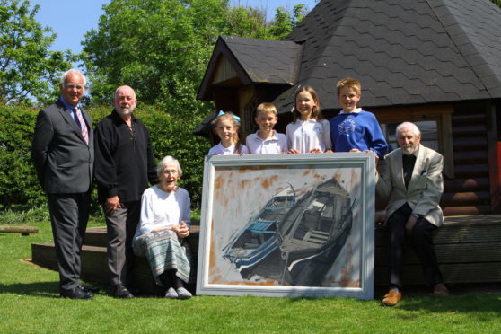 At an event earlier this year, Angus artist James Morrison R.S.A, R.S.W, with his painting Catterline Boats with (from left), Gordon Ritchie,  Dave Ramsay, Ann Keddie and pupils Lily Buchanan, Cameron Ramsay, Hannah Boggon and Magnus Gowland.