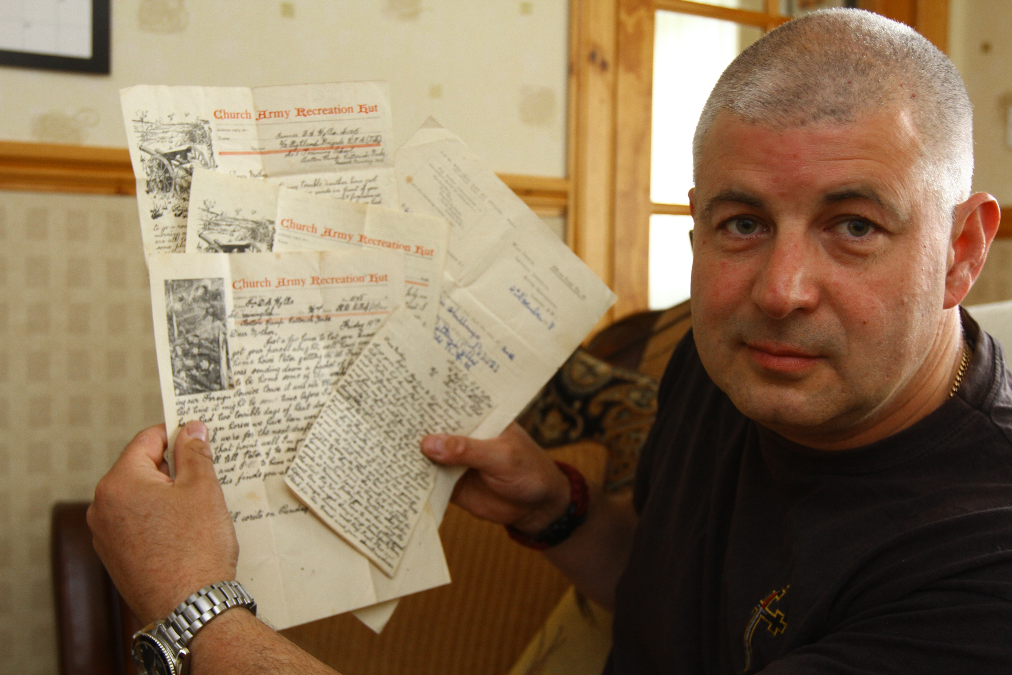 Mr Robertson with some of the documents