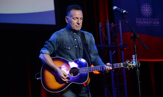 Bruce Springsteen performs on stage