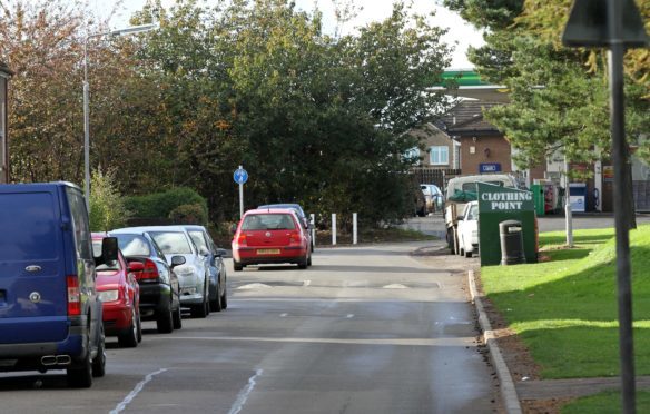 Badly parked cars have caused a problem in Lawrence Drive