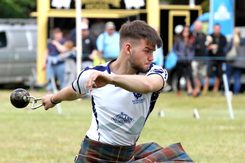 17 year old Shaun Duthie from Kirriemuir throwing the 16ib weight for distance at Strathmore Highland Games