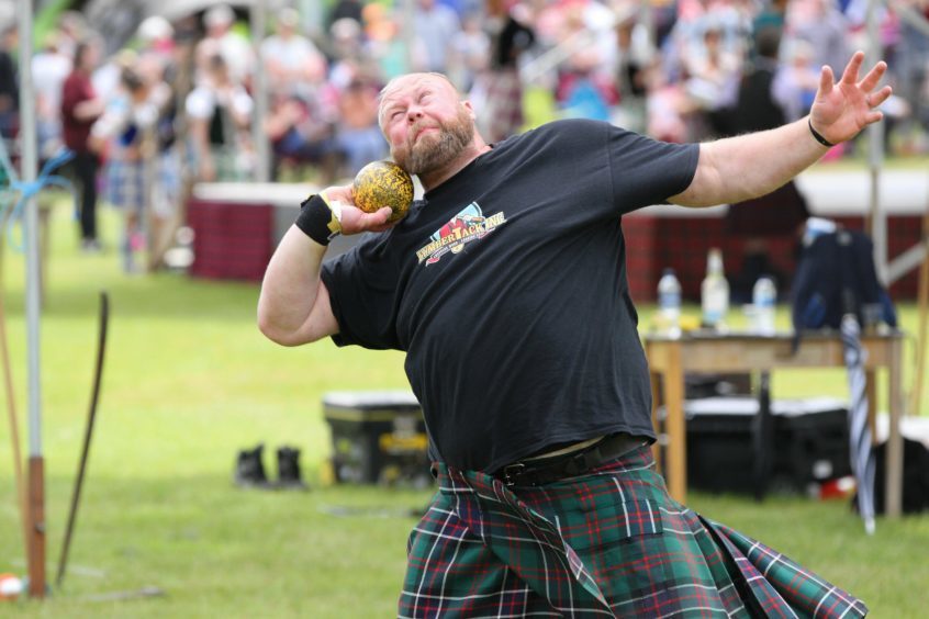 Craig Sinclair of Drumoak takes part in the men's shot putt at Strathmore Highland Games