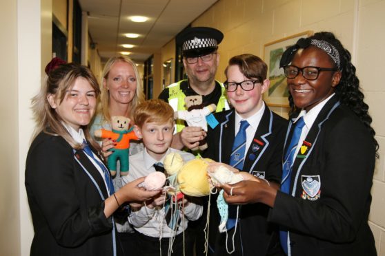 Rebecca Makepeace, a school support specialist from Duncan of Jordanstone with PC Andy Kerr with pupils Anna Rae, Will Plenderleaph, Ben Ramsay and Emmanuella Damptey.