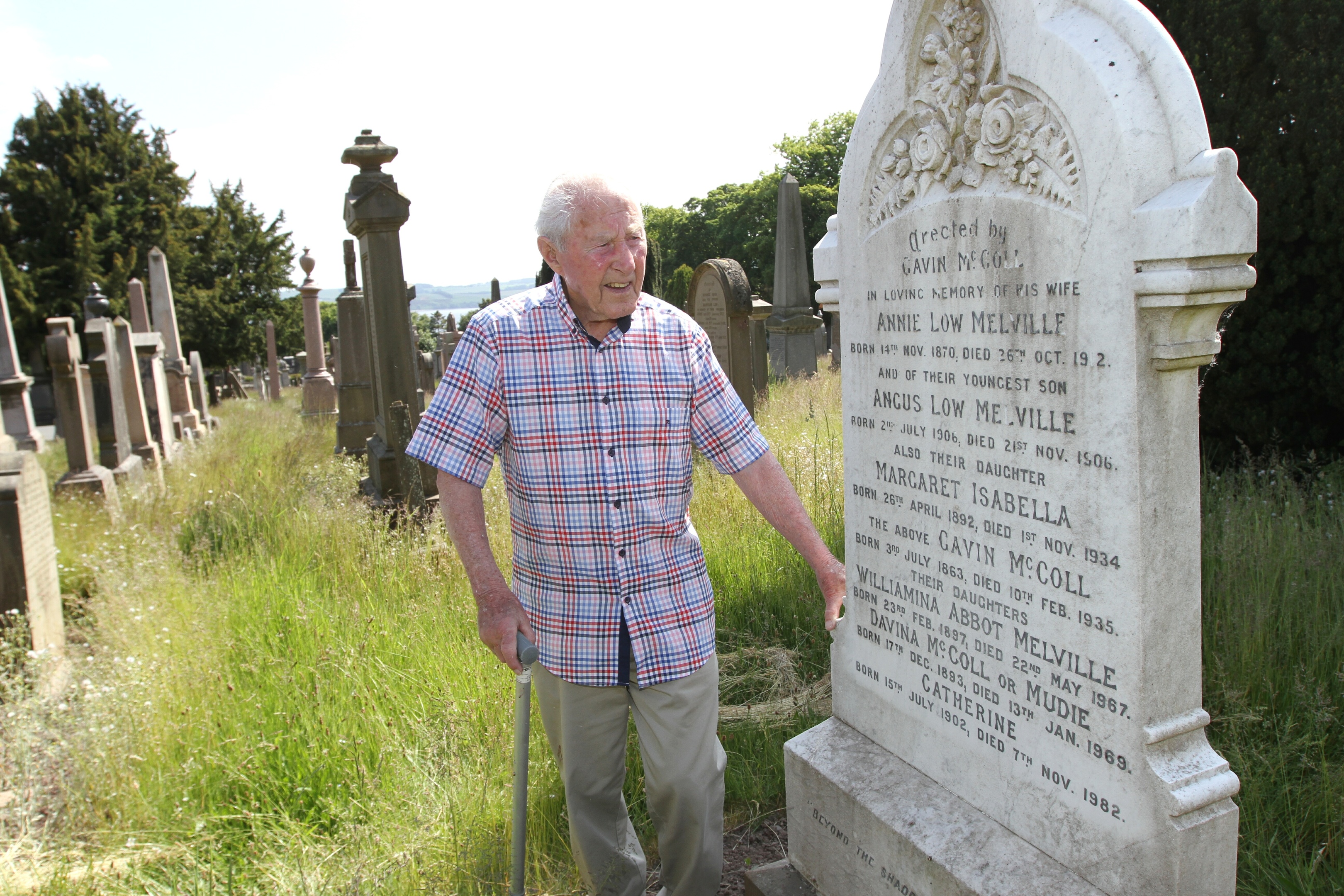 Stanley McColl is disgusted with the state of the grass in the Western Cemetery around his family grave