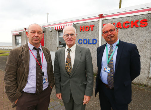 Councillor Ross Vettraino in between enforcement officers Billy Stevenson and Alan Bruce