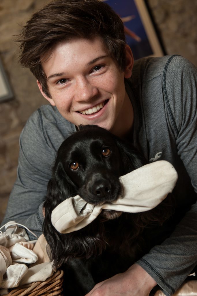 Harris Bell, 18, with the family dog, Izzy, 