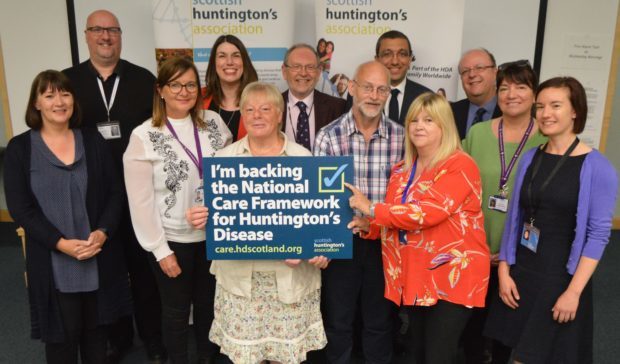 Back row L-R: Pete Carruthers, Specialist HD Youth Adviser; Nicky Connor, Associate Director of Nursing, Fife Health & Social Care Partnership; Cllr Tim Brett, Chair, Fife HSCP Health & Clinical Care Governance Committee; Dr Michael Armanyous, Consultant Psychiatrist & Lead HD Clinician for NHS Fife; John Eden, CEO, Scottish Huntington’s Association
Front row L-R: Debbie Pitcaithly, Clinical Psychologist; Jillian Foster, Senior HD Specialist; Sue Gray, HD family member; Brian Gray, HD family member; Nicola Johns, HD Specialist; Norma Henderson, HD Resource Worker; Jo Baldock, Senior Financial Wellbeing Officer