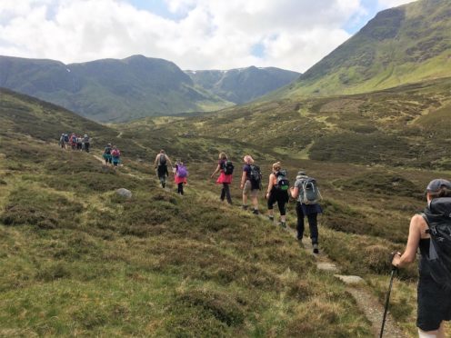 Walkers enjoying the tranquil Angus Glens.