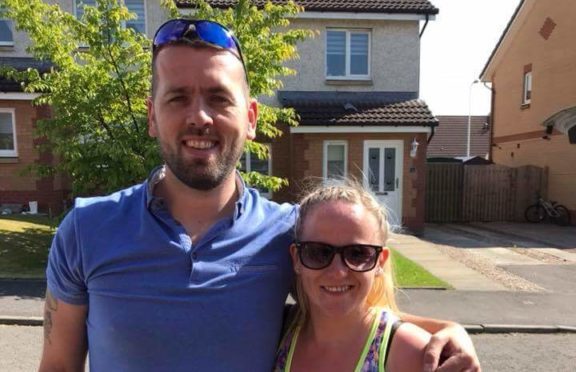 Siobhan with her husband Jamie, before setting off for her walk.