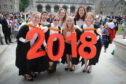 Friends who have graduated with a Joint Degree - back l to r - Anna-Leigh Ong, Georgina Farrington and Ashley Brenton - front - Raney Warner, Paula Wagner, Hannah Richman and Emily Asinger, St Salvators Quad.