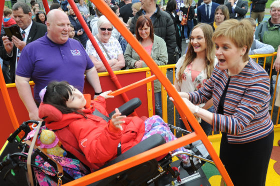 First Minister Nicola Sturgeon opens an inclusive play park in Dunfermline. Picture shows; front - l to r - Collette Duffy (12) and  First Minister Nicola Sturgeon - back  Brian Rodger (Chairman Play as One Scotland) and Colette's mum Cara McHale. While that will remain for the foreseeable future, other play parks may not.