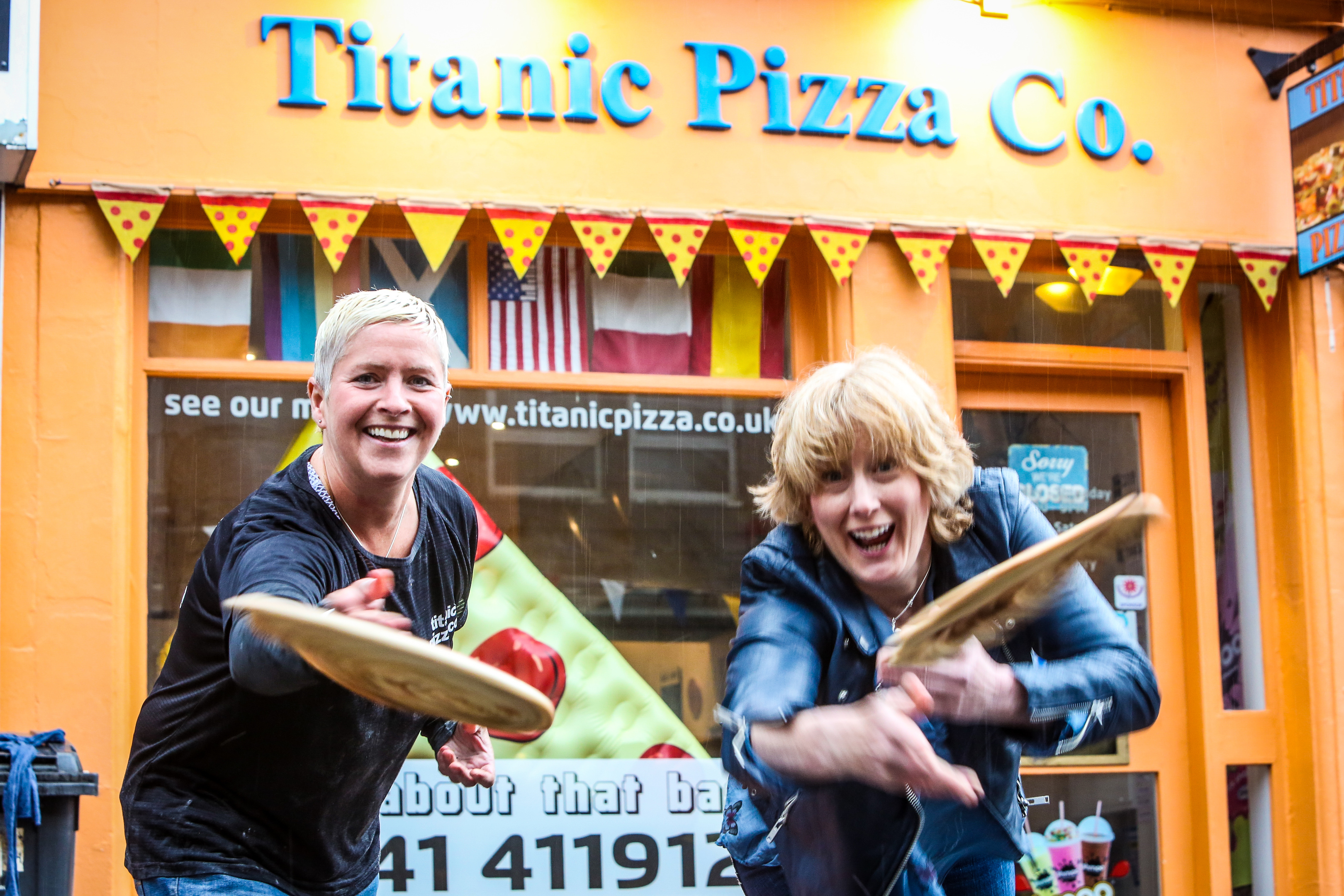 The upcoming Carnoostival festival will feature a pizza flinging competition instead of a discus contest. The pizza bases are being supplied by Marie Fagan (left) of the town's Titanic Pizza. Marie is shown with festival organiser Suzi Caesar.