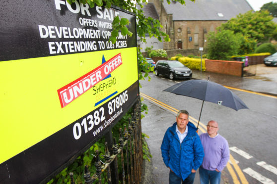 Councillors Brian Boyd and David Cheape looking for answers for the derelict site.