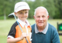 Archie Pattullo with grandad, Don Murray on Strathmore Golf Club.