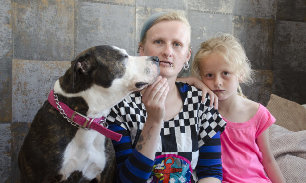 Leonie Leaver with her dauhter Cali (7) and dog Katana, which was left burnt by hogweed .