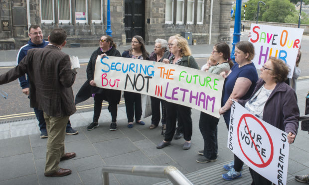 Protesters demonstrate outside Perth and Kinross Council HQ.