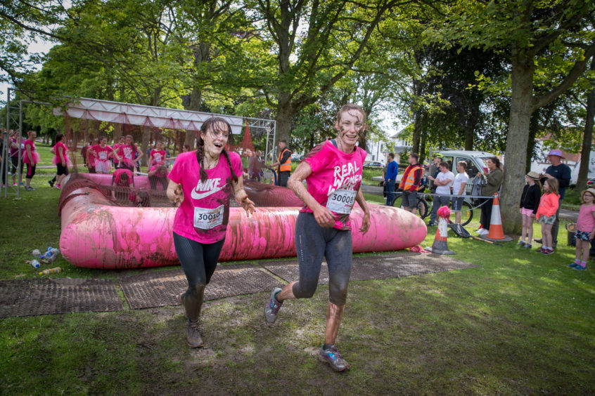 Sarah Jesty (L) and Courier reporter Cheryl Peebles (Middle) take on the muddy 5K on Saturday, which is part of the Race for Life.