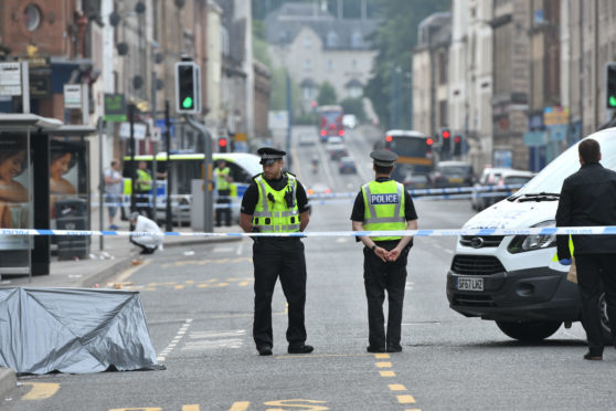 Police at the scene of the violent assault in South Street, Perth, in June last year.