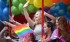 People take part in the Pride Glasgow parade through the city centre.