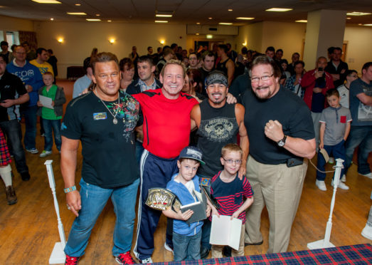 Former WWE superstars in Dundee for a previous Hell for Lycra event. From left, Tatanka, Rowdy Roddy Piper, Chavo Guerrero and Ted DiBiase with young fans