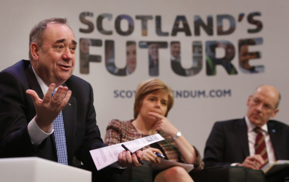 Alex Salmond, left, with Nicola Sturgeon and John Swinney