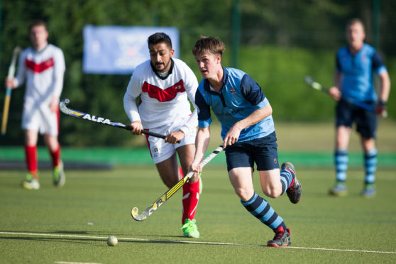 St Andrews University hockey players in action.